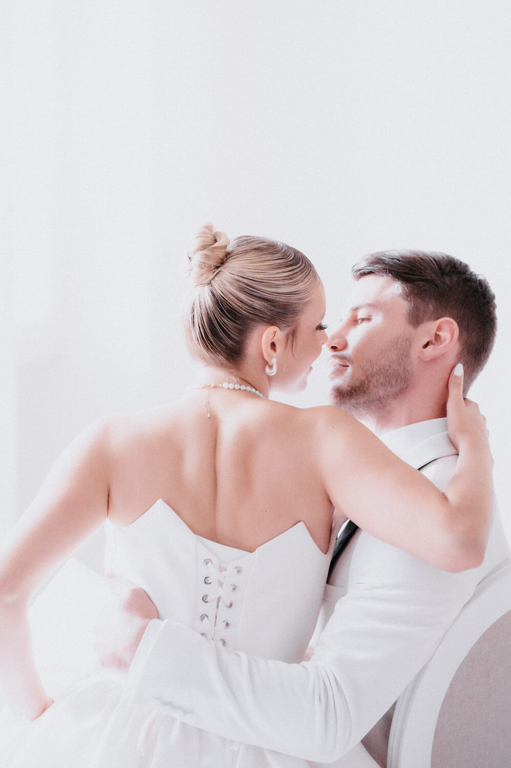 Close wedding portrait capturing a quiet moment between bride and groom